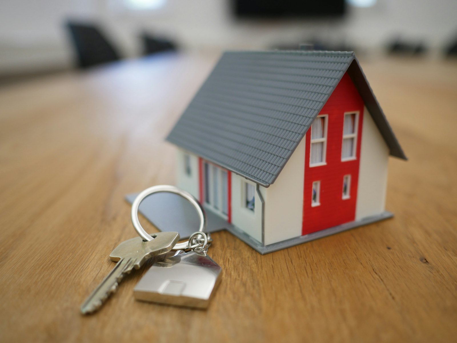 Model house with keys representing property investment