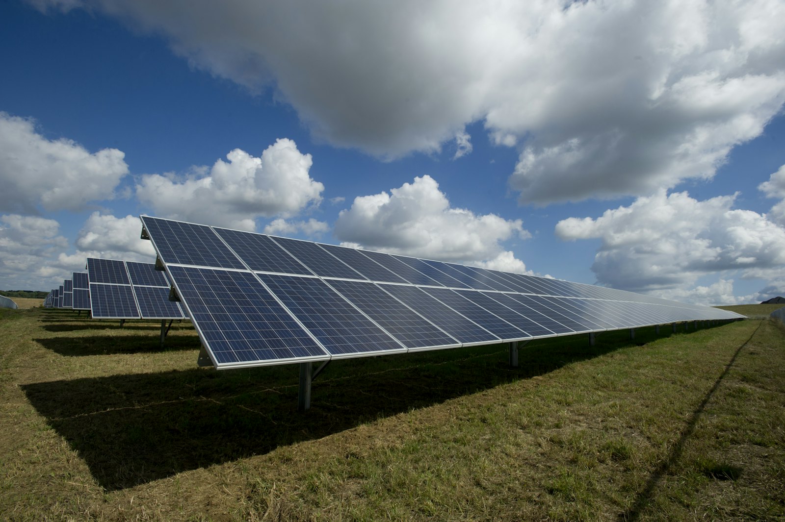 Solar energy farm under a blue sky